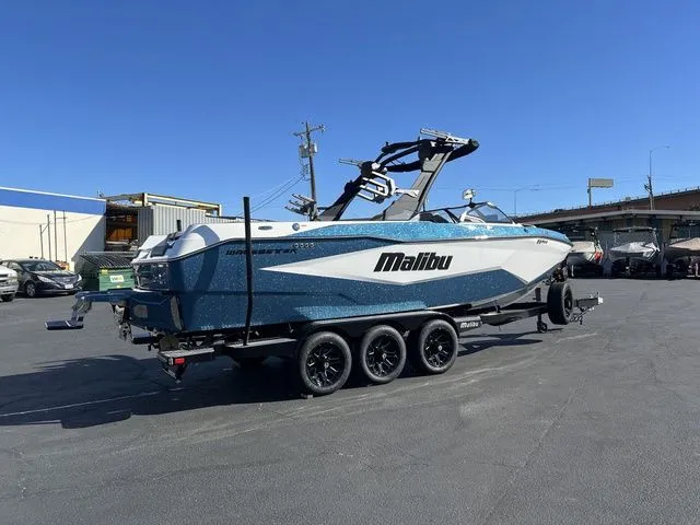 Slide: The Image of 2026 Malibu Wakesetter 25 LSV boat on trailer, blue sky. - 3