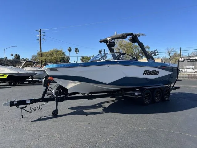 Slide: The Image of 2026 Malibu Wakesetter 25 LSV boat on trailer outdoors. - 4