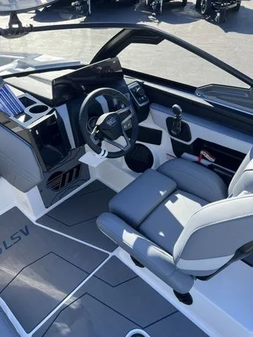 Slide: The Image of Interior of 2026 Malibu Wakesetter 25 LSV with modern helm. - 7