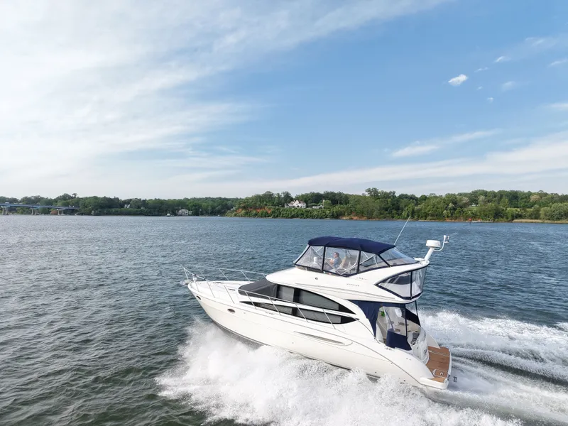 Slide: The Image of 2008 Meridian 391 Sedan cruising on a serene lake under clear skies. - 10