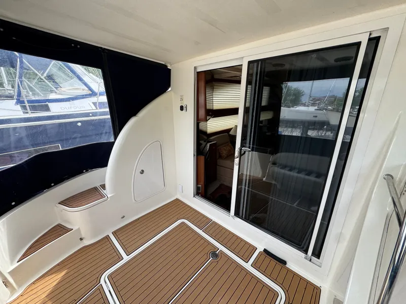 Slide: The Image of 2008 Meridian 391 Sedan Yacht with teak flooring and sliding glass door. - 14