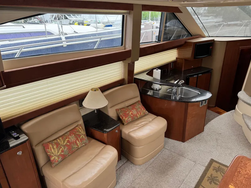 Slide: The Image of Interior of a 2008 Meridian 391 Sedan yacht with seating area and kitchenette. - 19
