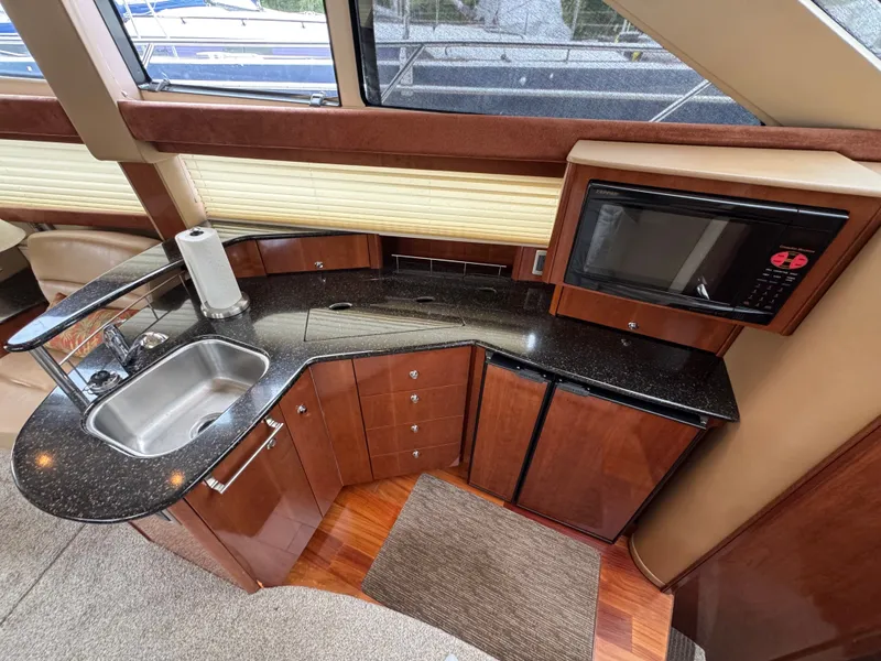 Slide: The Image of Interior of 2008 Meridian 391 Sedan with kitchen and microwave. - 22