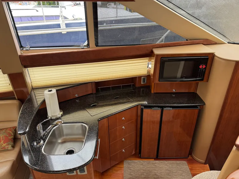 Slide: The Image of Interior of 2008 Meridian 391 Sedan with kitchen and microwave. - 23