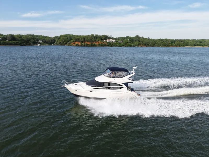 Slide: The Image of 2008 Meridian 391 Sedan cruising on a calm lake under clear skies. - 3