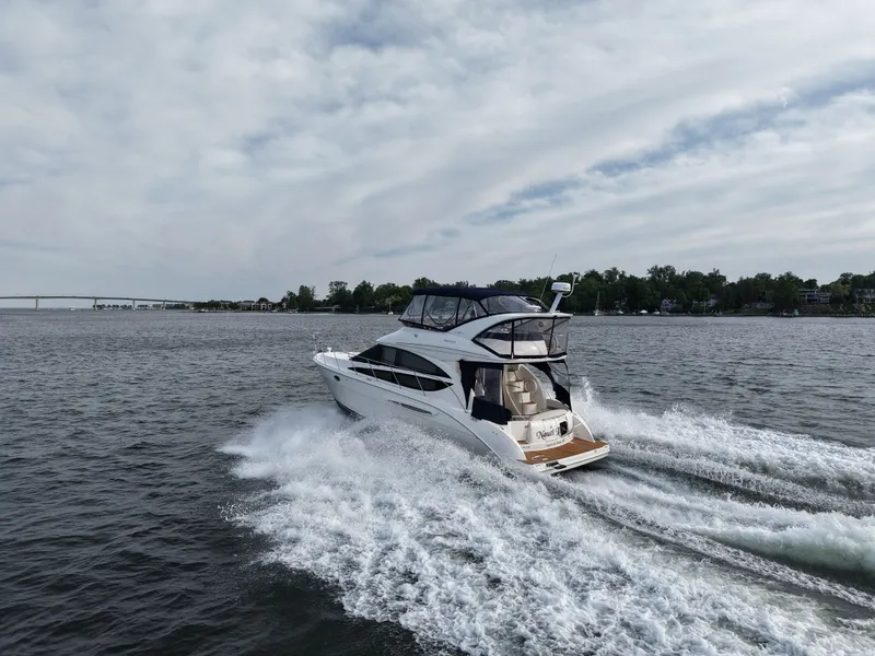 Slide: The Image of 2008 Meridian 391 Sedan yacht cruising on open water. - 6