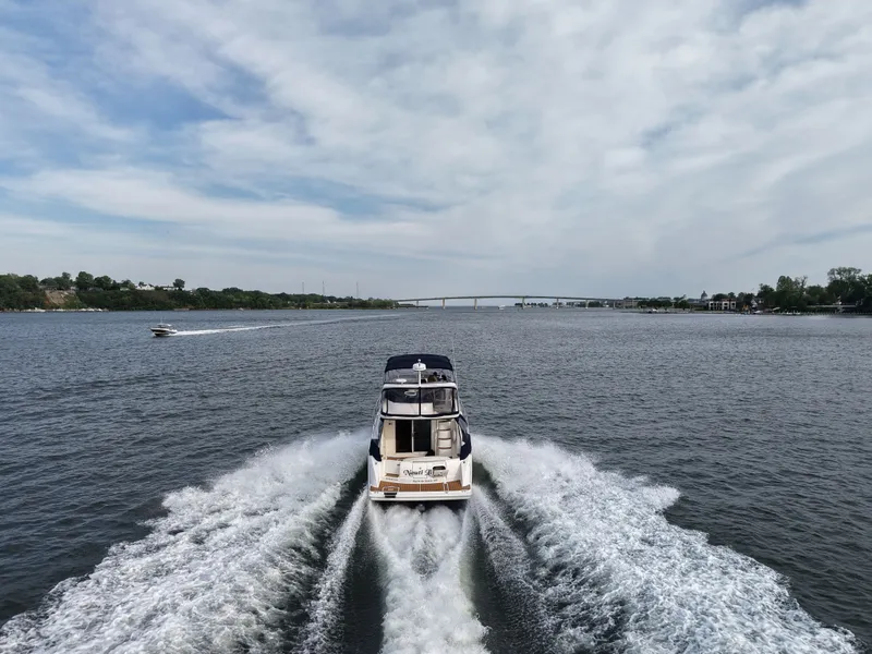 Slide: The Image of 2008 Meridian 391 Sedan on open water, bridge in background. - 7