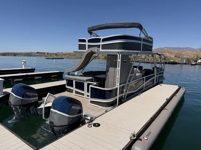 Slide: The Image of 2022 Premier Escalante 310 DL pontoon boat at dock. - 4