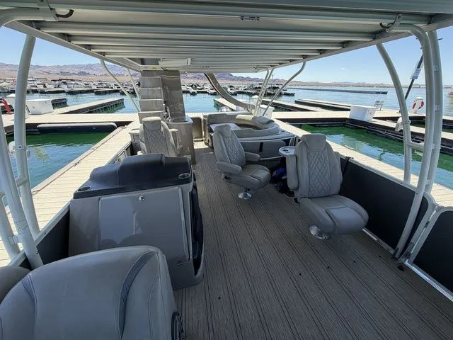 Slide: The Image of Interior view of a 2022 Premier Escalante 310 DL pontoon boat at dock. - 7