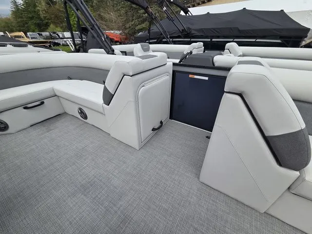 Slide: The Image of Interior of 2026 Crest Conquest SE 220 Cruise Tri-Toon with gray upholstery. - 11