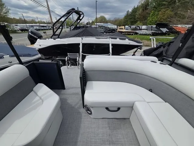 Slide: The Image of Interior of 2026 Crest Conquest SE 220 Cruise Tri-Toon with gray seating. - 15