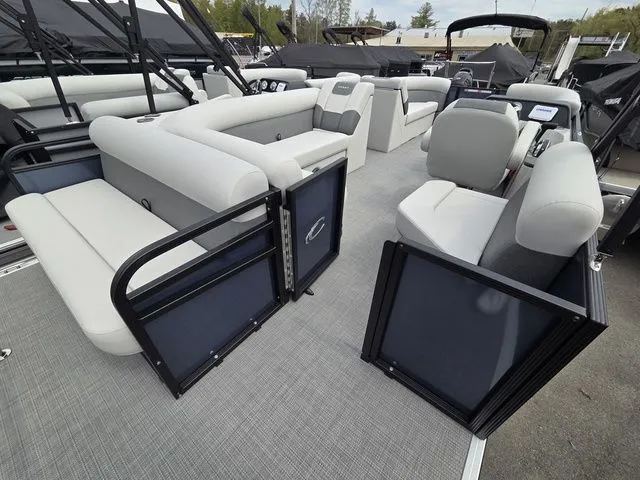 Slide: The Image of Interior of 2026 Crest Conquest SE 220 Cruise Tri-Toon with gray seating. - 18