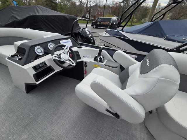Slide: The Image of Interior of 2026 Crest Conquest SE 220 Cruise Tri-Toon with helm console. - 21