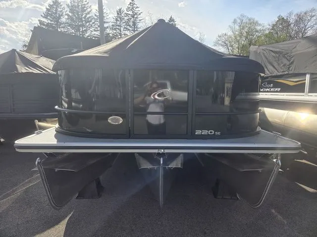 Slide: The Image of 2026 Crest Conquest SE 220 Cruise Tri-Toon with trailer, front view. - 3