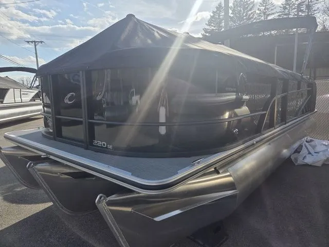 Slide: The Image of 2026 Crest Conquest SE 220 Cruise Tri-Toon with trailer, side view. - 4