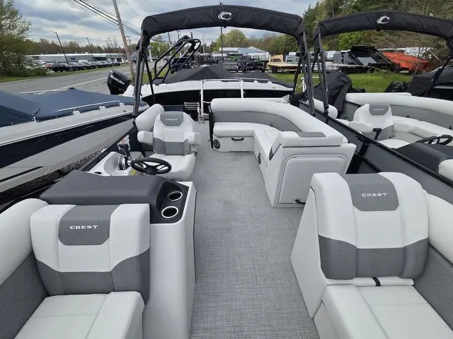 Slide: The Image of Interior of 2026 Crest Conquest SE 220 Cruise Tri-Toon with luxurious seating. - 9