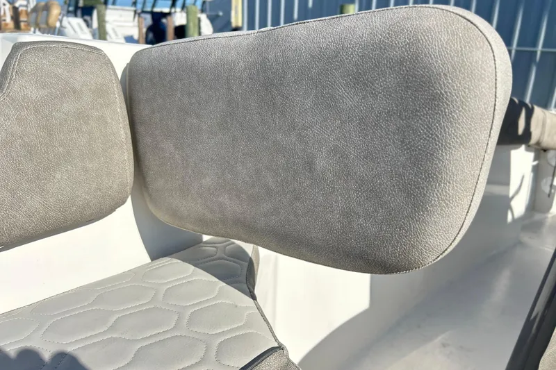 Slide: The Image of 2021 Sea Fox 228 Commander boat seat with textured upholstery in sunlight. - 12