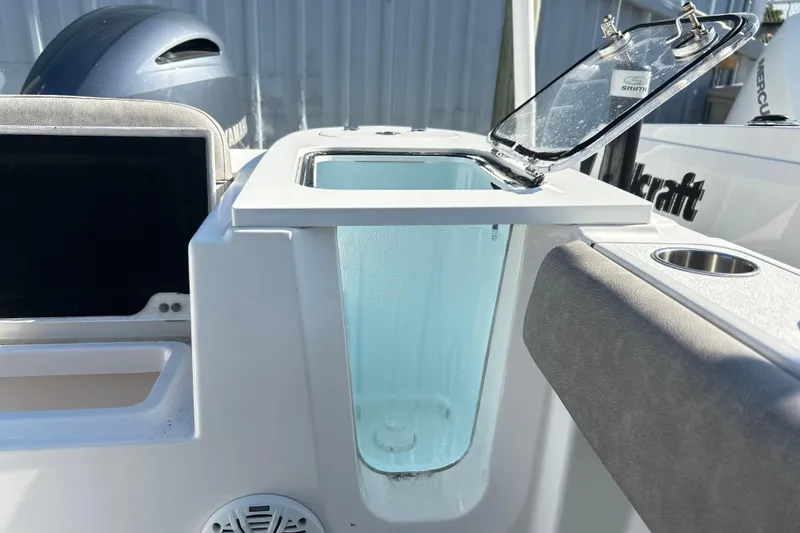 Slide: The Image of 2021 Sea Fox 228 Commander boat with open livewell and Yamaha engine in background. - 15