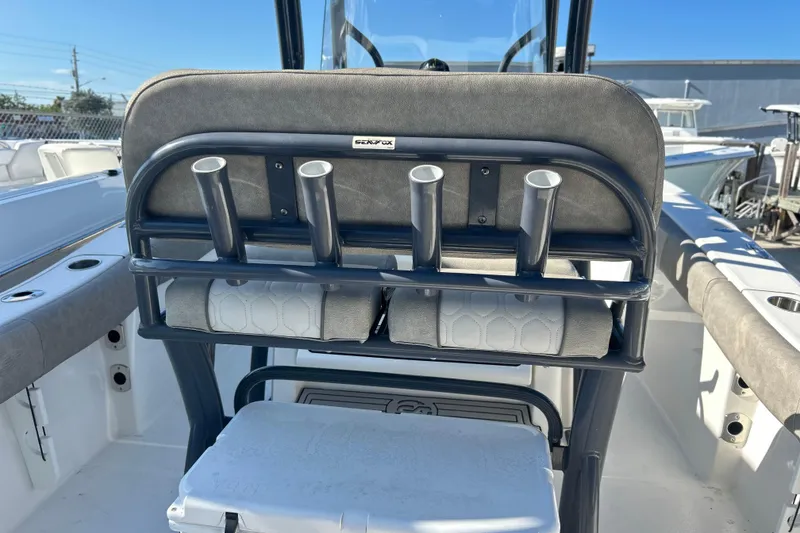 Slide: The Image of 2021 Sea Fox 228 Commander boat interior with rod holders and seating. - 16