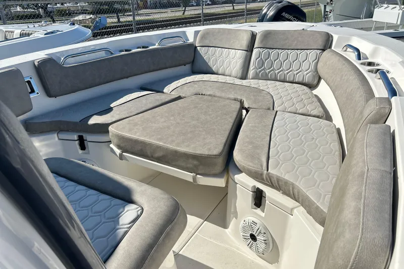 Slide: The Image of 2021 Sea Fox 228 Commander boat interior with cushioned seating and modern design. - 4