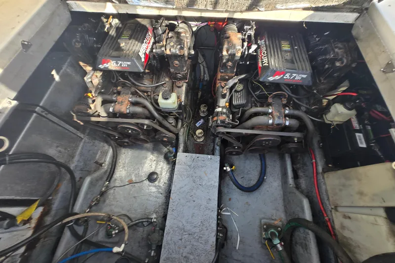 Slide: The Image of Engine compartment of a 2000 Sea Ray 290 Amberjack with twin Mercury 5.7L engines. - 11
