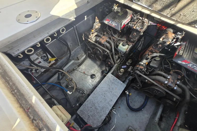 Slide: The Image of Engine compartment of a 2000 Sea Ray 290 Amberjack with dual Mercury 5.7L engines. - 25