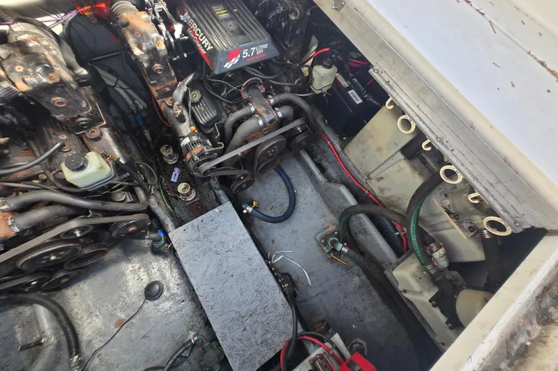 Slide: The Image of Engine compartment of a 2000 Sea Ray 290 Amberjack with Mercury 5.7L engine. - 26