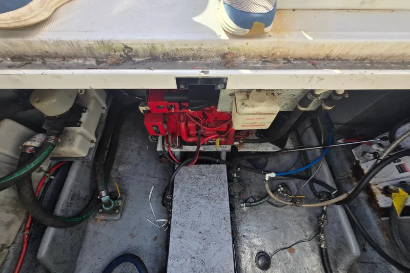 Slide: The Image of Engine compartment of a 2000 Sea Ray 290 Amberjack boat, showing mechanical components. - 27