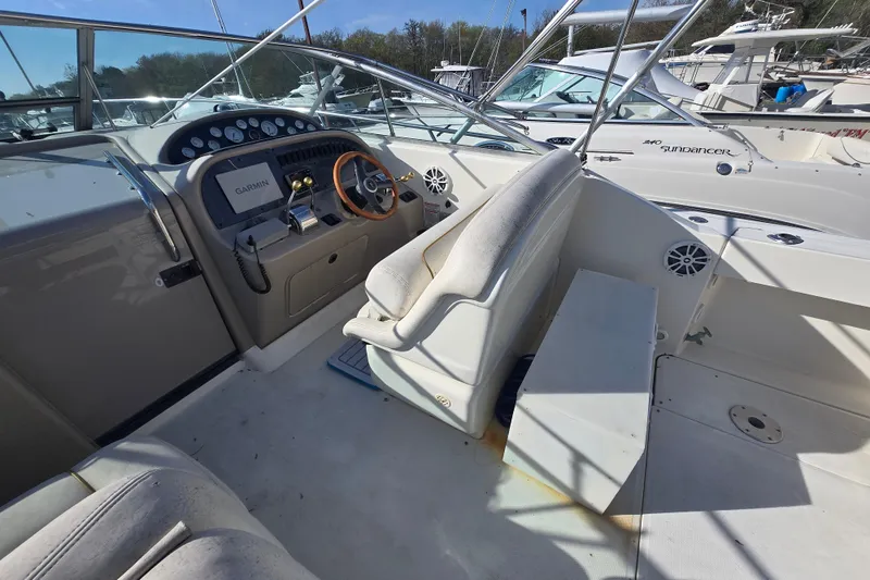 Slide: The Image of Cockpit of 2000 Sea Ray 290 Amberjack with Garmin navigation and leather seating. - 3