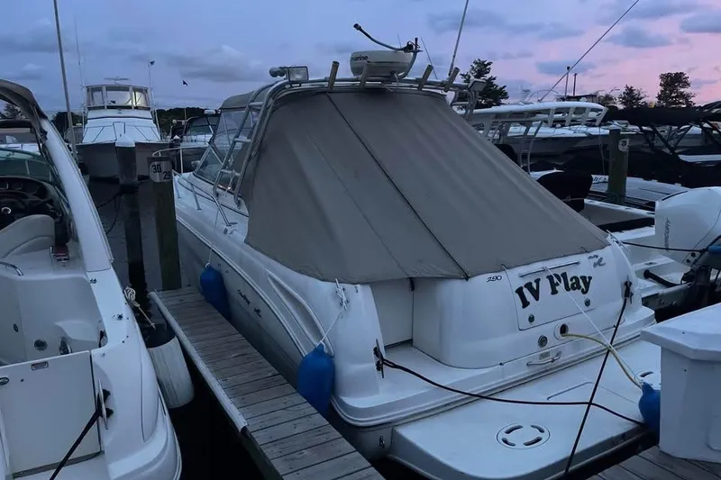 Slide: The Image of 2000 Sea Ray 290 Amberjack docked at marina during sunset. - 32