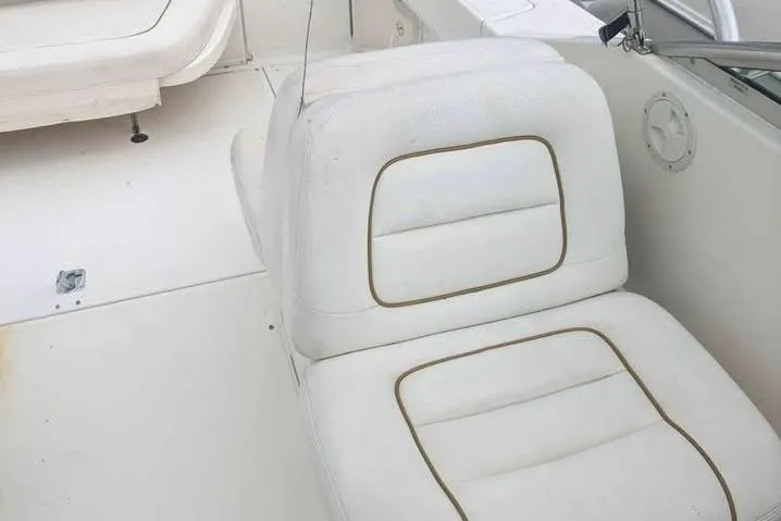 Slide: The Image of White seating on a 2000 Sea Ray 290 Amberjack boat. - 33
