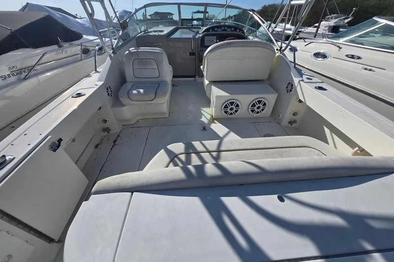 Slide: The Image of 2000 Sea Ray 290 Amberjack boat interior with seating and control panel. - 4