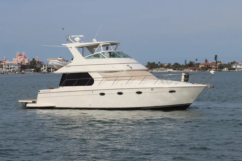 The Image of 2005 Carver 46 Voyager yacht on calm waters. - 0