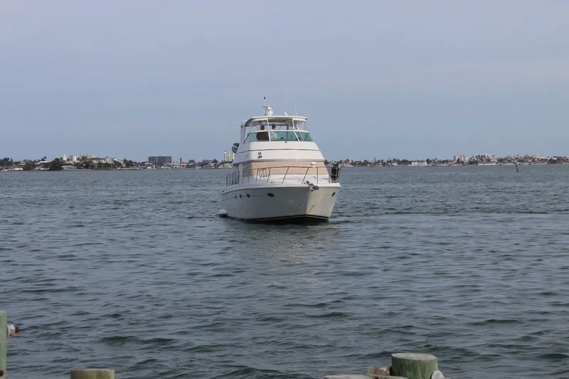 Slide: The Image of 2005 Carver 46 Voyager yacht on open water. - 2