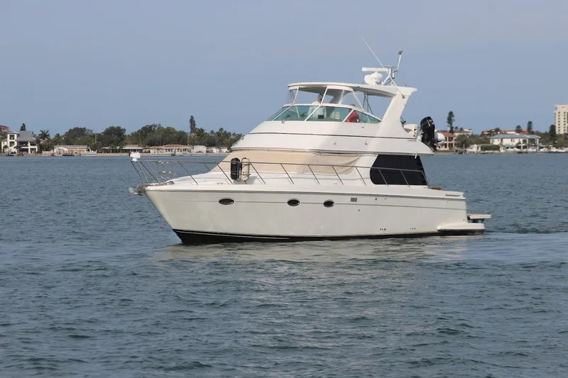 Slide: The Image of 2005 Carver 46 Voyager yacht on calm waters. - 22