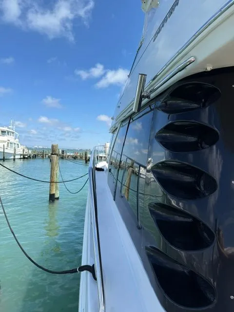 Slide: The Image of Side view of 2005 Carver 46 Voyager yacht docked in harbor. - 28