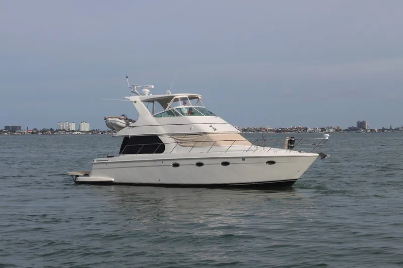 Slide: The Image of 2005 Carver 46 Voyager yacht on calm waters. - 3