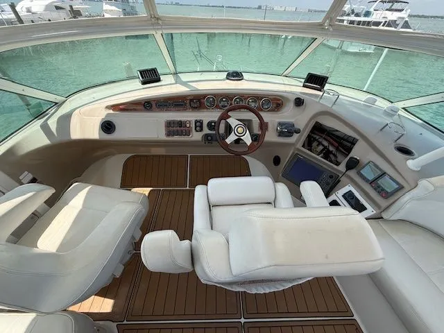 Slide: The Image of Interior view of 2005 Carver 46 Voyager cockpit with controls. - 30