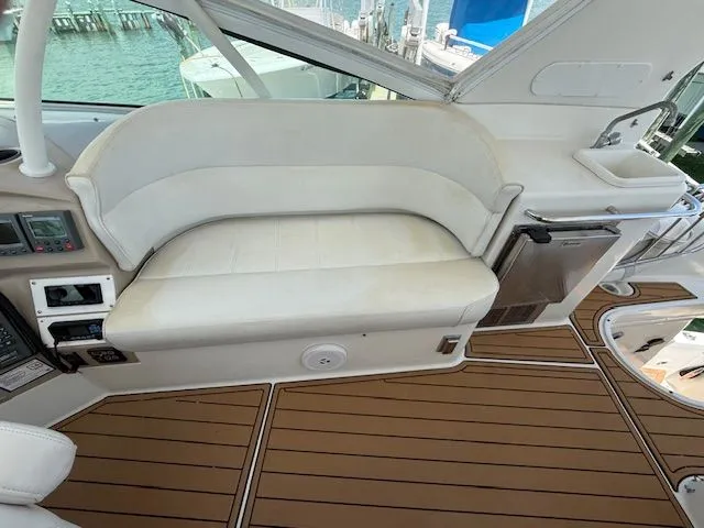 Slide: The Image of Interior of 2005 Carver 46 Voyager with white seating and wood flooring. - 37