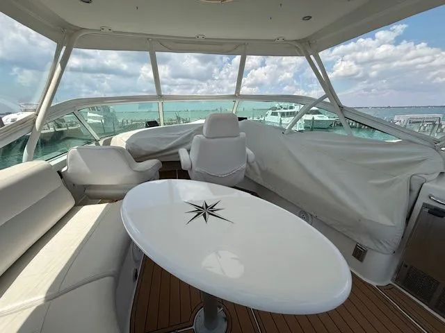 Slide: The Image of Interior of a 2005 Carver 46 Voyager yacht with table and seating area. - 38