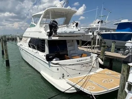 Slide: The Image of 2005 Carver 46 Voyager yacht docked at marina. - 41