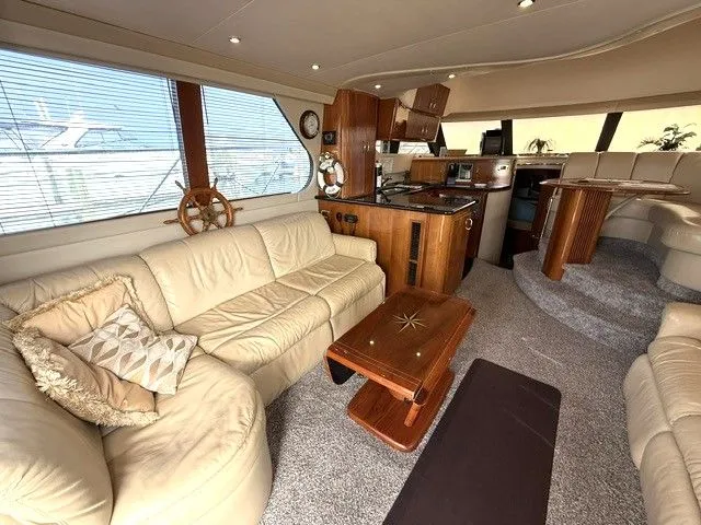 Slide: The Image of Interior of 2005 Carver 46 Voyager yacht with luxurious design. - 43
