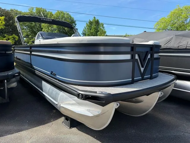 The Image of 2026 Viaggio Lago X-S 22 pontoon boat parked outdoors. - 1