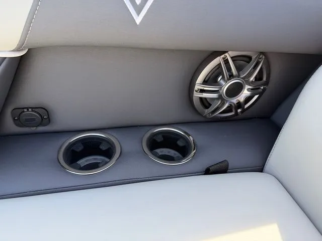 Slide: The Image of Interior of Viaggio Lago X-S 22 featuring speaker and cup holders, model year 2026. - 11