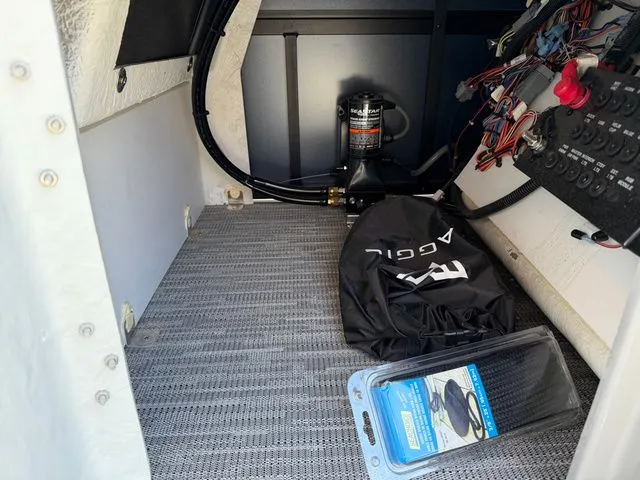Slide: The Image of Interior of Viaggio Lago X-S 22 boat, showcasing equipment and accessories. - 12