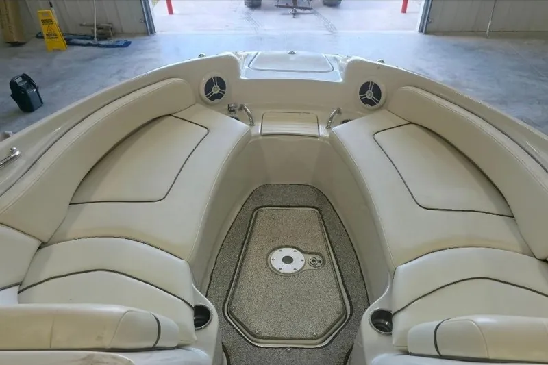 Slide: The Image of Interior view of a 2008 Sea Ray 240 Sundeck boat with beige seating. - 12