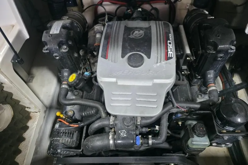 Slide: The Image of Engine of a 2008 Sea Ray 240 Sundeck boat, featuring a Mercury 350 MAG. - 15