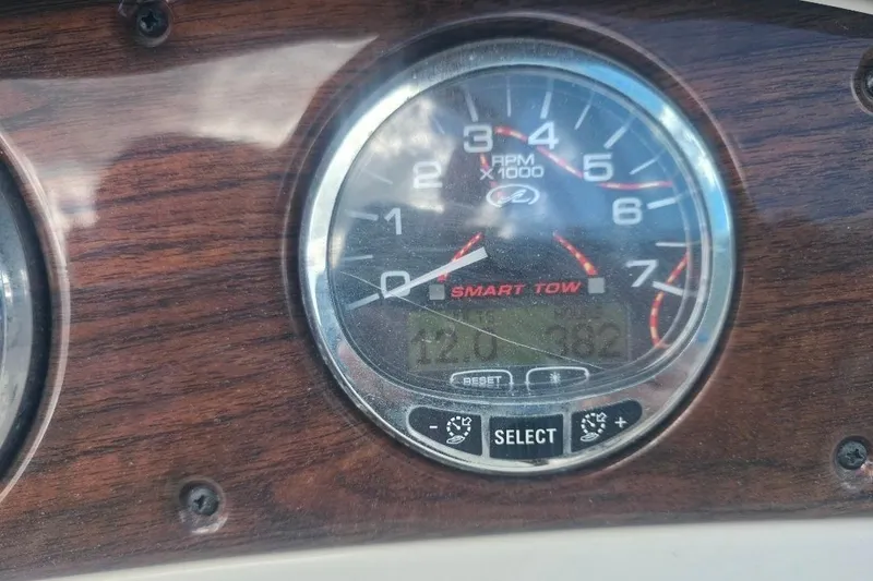 Slide: The Image of Close-up of 2008 Sea Ray 240 Sundeck tachometer with wood paneling. - 18