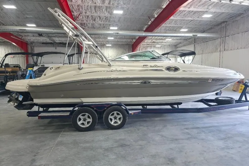 Slide: The Image of 2008 Sea Ray 240 Sundeck boat on trailer in indoor storage facility. - 4