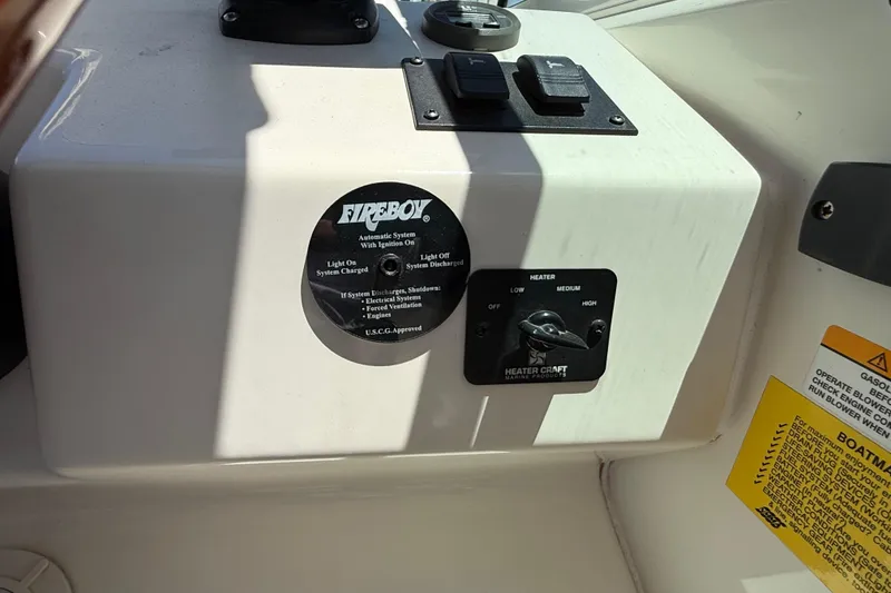 Slide: The Image of Control panel of a 1996 Sea Ray 250 Sundancer boat with Fireboy system. - 16